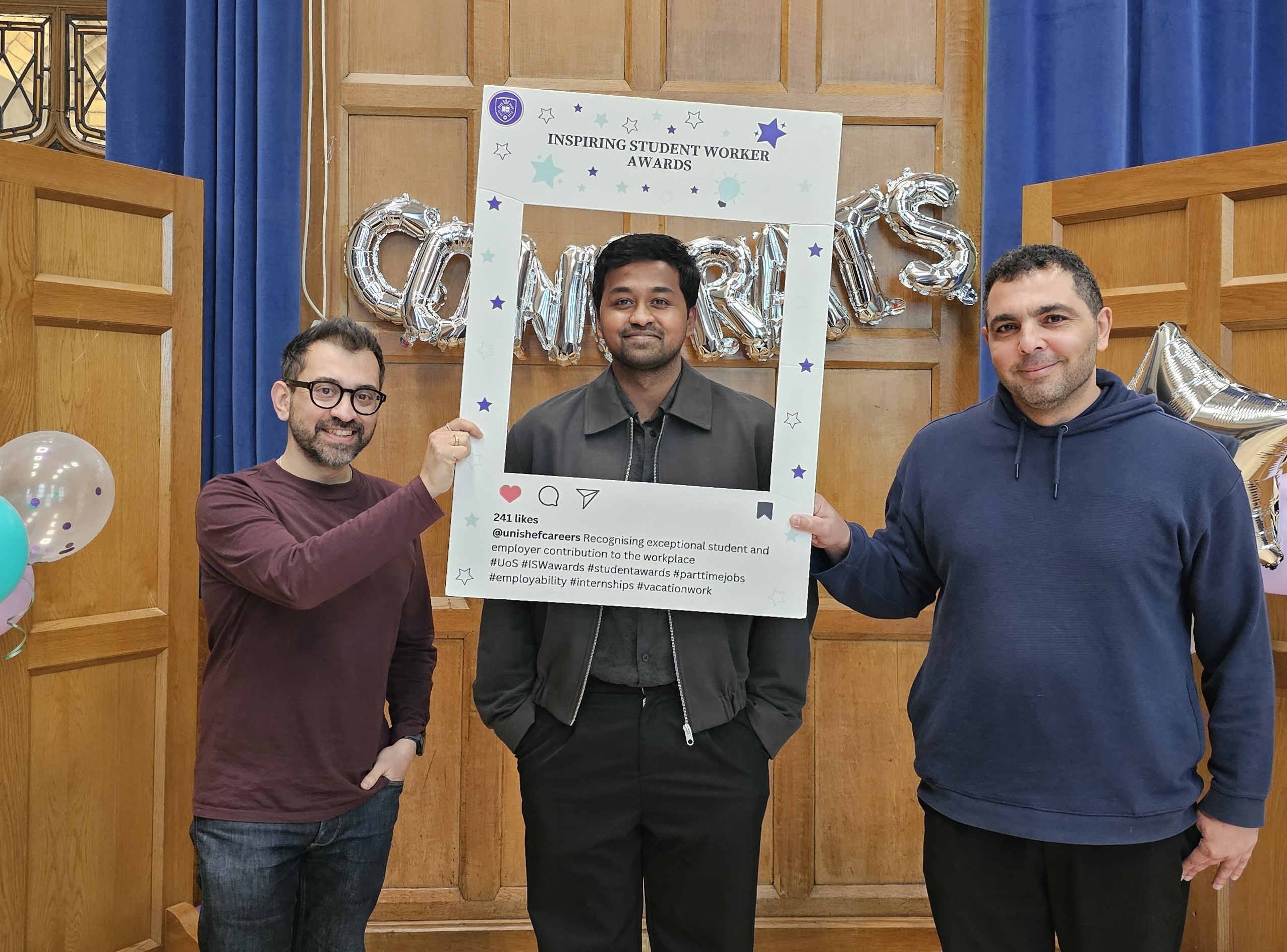 Holding the Inspiring Student Worker Awards frame